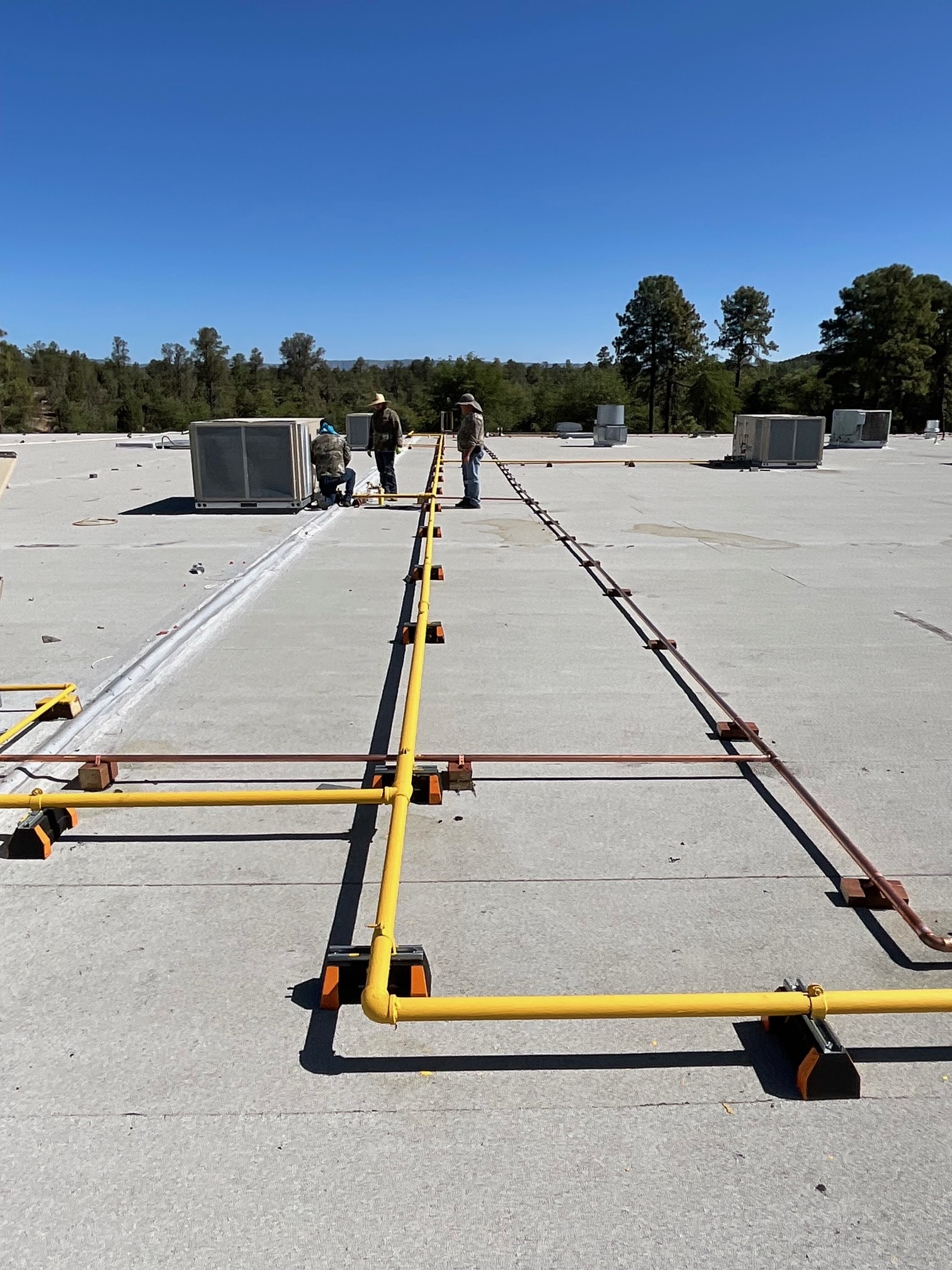 Commercial piping work on a rooftop